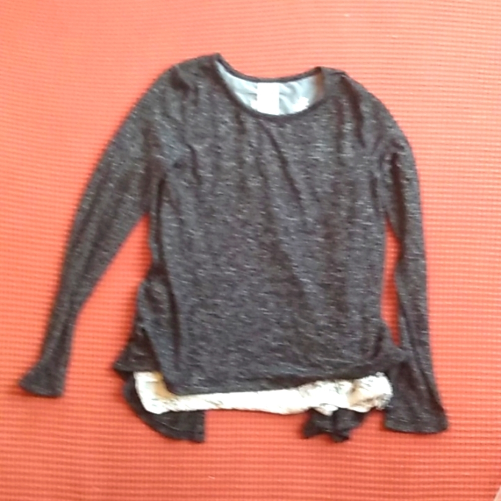 Black shirt with white layer underneath